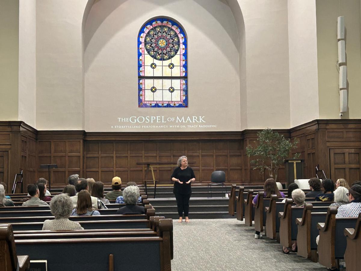 Tracy Radosevic performing the Gospel of Mark on stage in Abilene, Texas