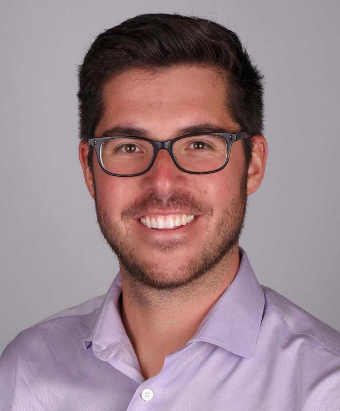 man smiling in glasses
