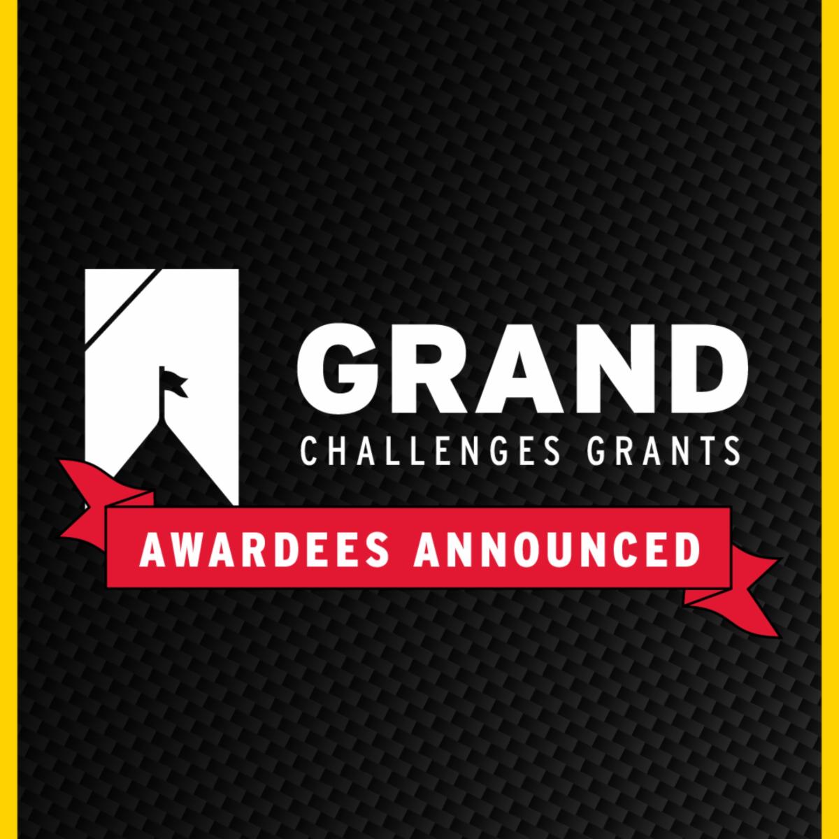 A graphic announcement featuring a white logo and the text "GRAND CHALLENGES GRANTS" next to a red ribbon that reads "AWARDEES ANNOUNCED" against a black textured background.