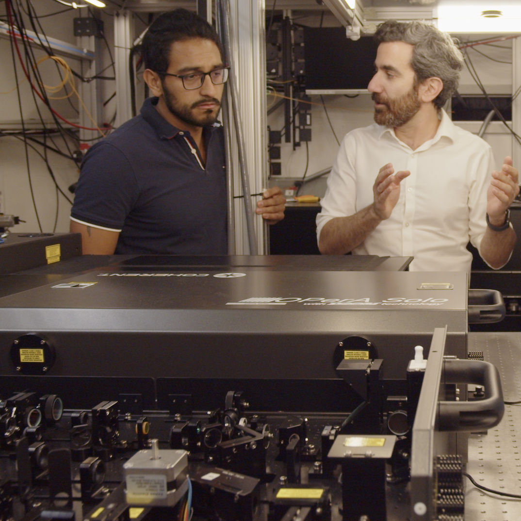 Mohammad Hafezi talks with another researcher