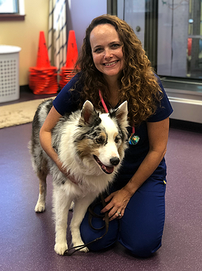 Dr. Kara Amstutz with a dog professor