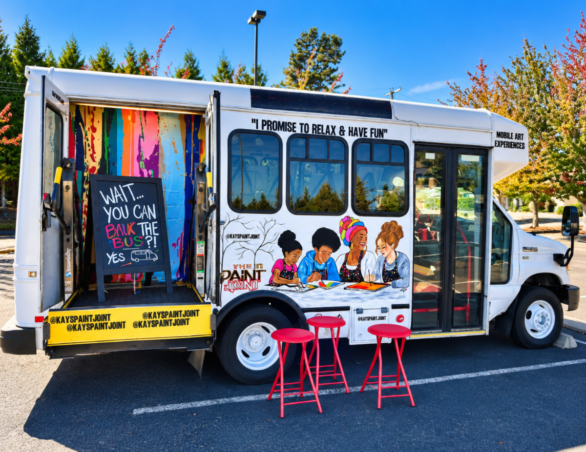 Kay’s Mobile Art Bus with open doors and colorful paintings