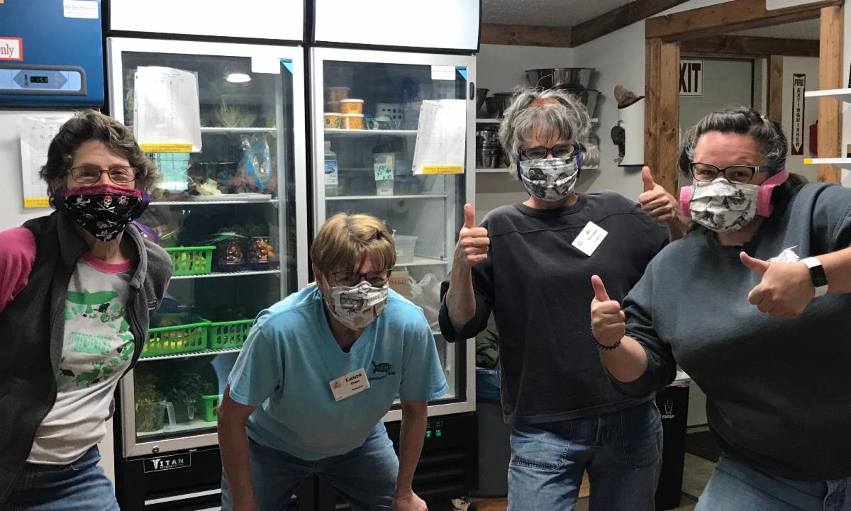 Volunteers with masks made by Ava F