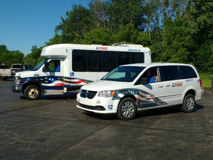 Two Gladwin City-County Transit vehicles used for servicing the community. 