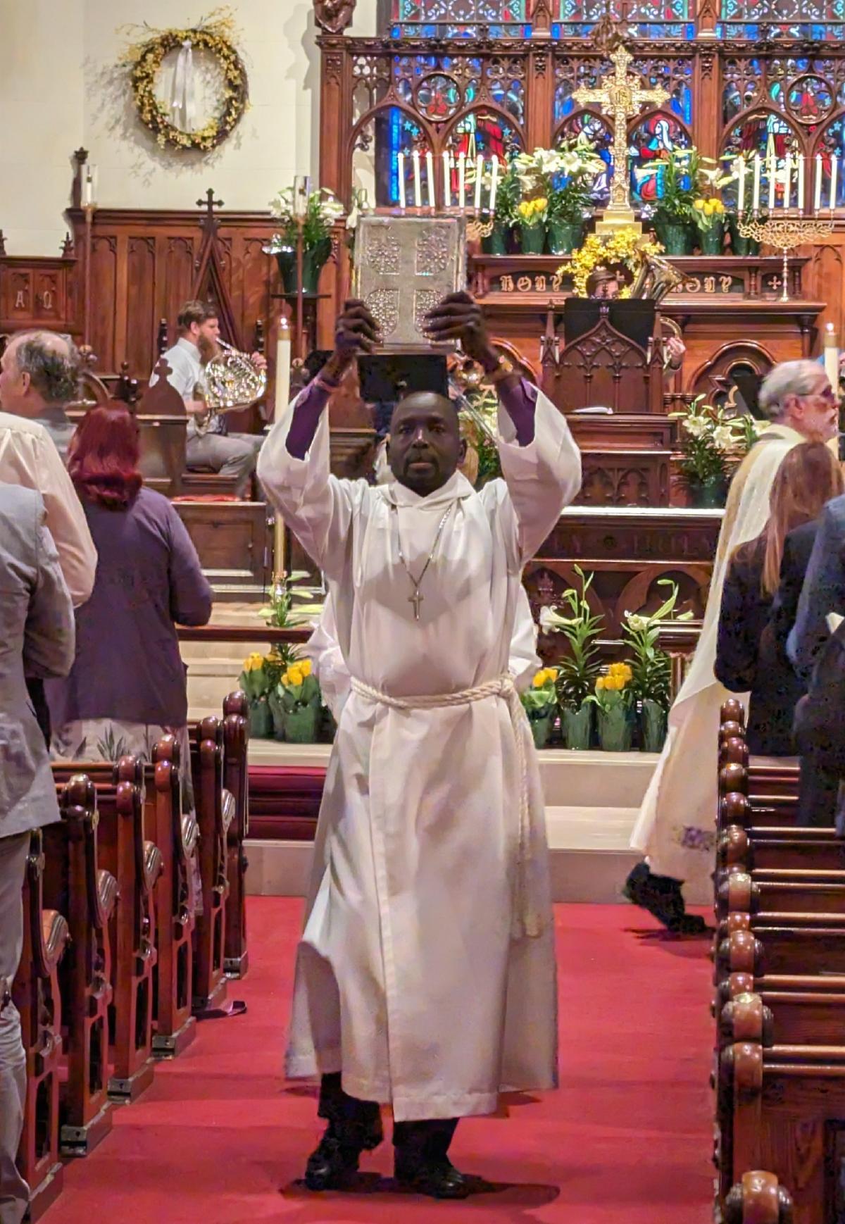 Thon Deng in procession from altar