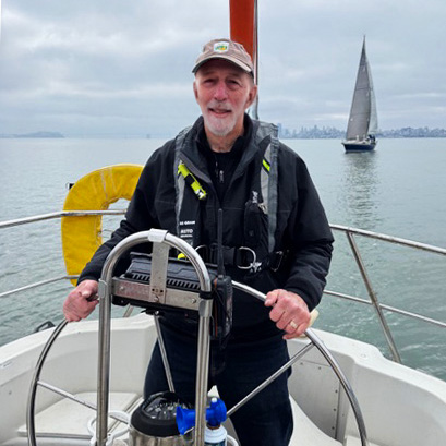 Joe Rockmore at the Helm of His Boat
