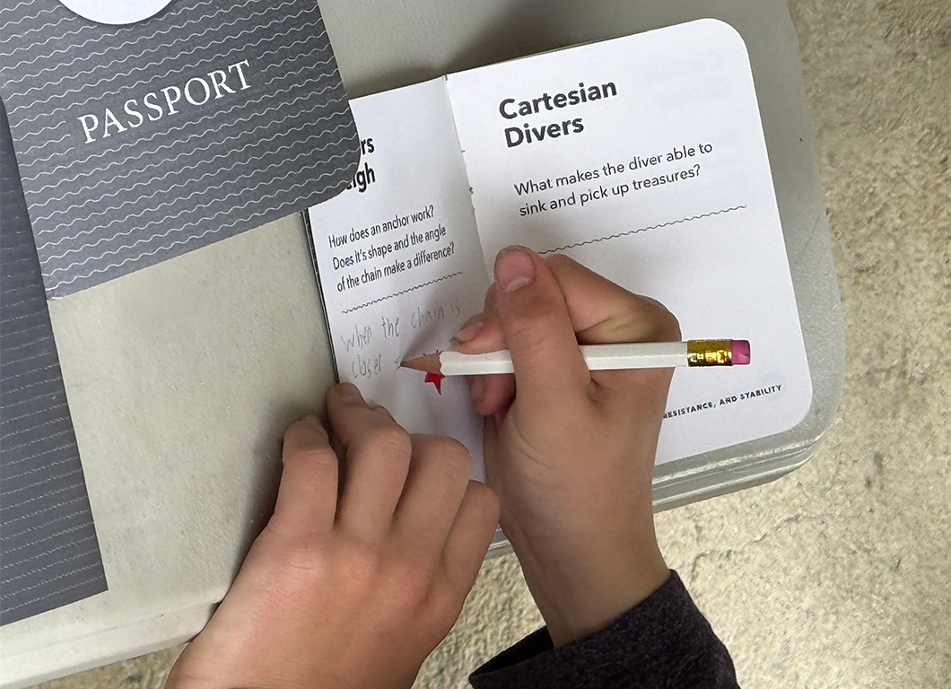 Student filling out a passport page