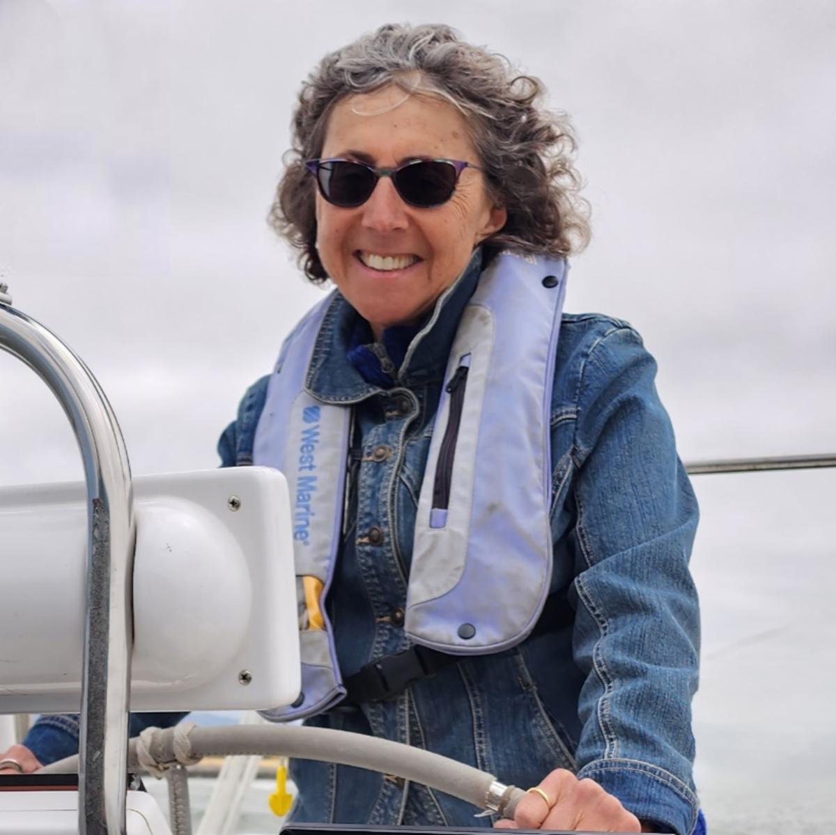 Melissa Grudin at the helm of her boat