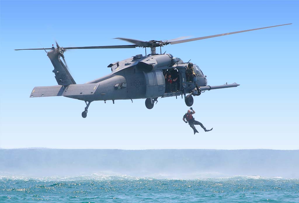 Navy Rescue Swimmer Jumping from Helocopter