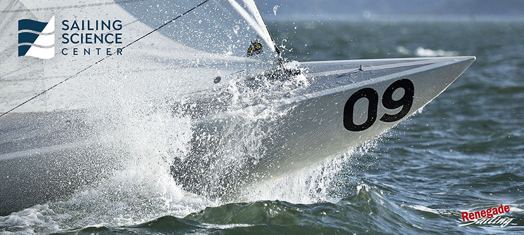 An Etchells bow punching through the waves