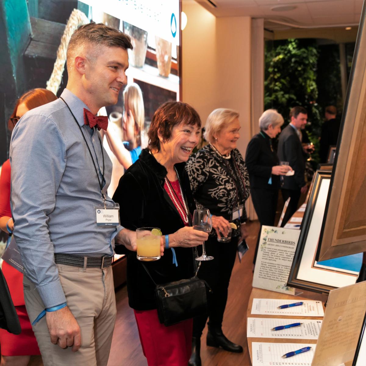 People Looking at Auction Items
