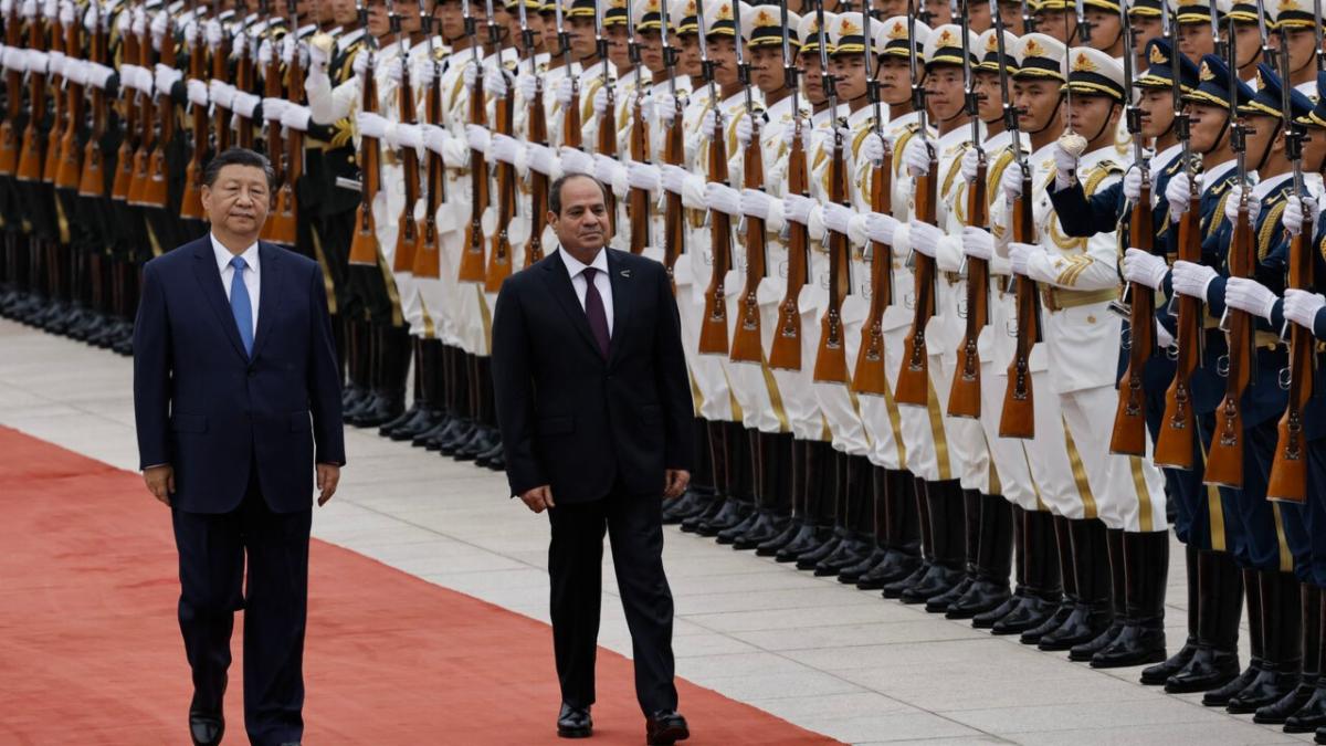 BEIJING, CHINA - MAY 29: Chinese President Xi Jinping walks next to Egyptian President Abdel Fattah al-Sisi (C) review the honour guard during a welcome ceremony for Egyptian President Abdel Fattah al-Sisi at the Great Hall of the People on May 29, 2024 in Beijing, China. (Photo by Tingshu Wang-Pool/Getty Images)