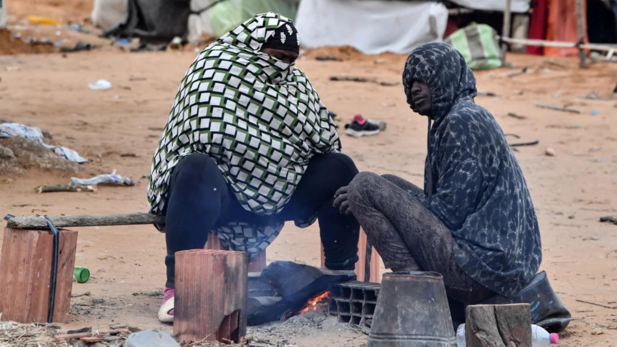 People migrating from Sub-Saharan Africa in Jebeniana, in the Tunisian governorate of Sfax, on 24 April (Fethi Belaid/AFP)