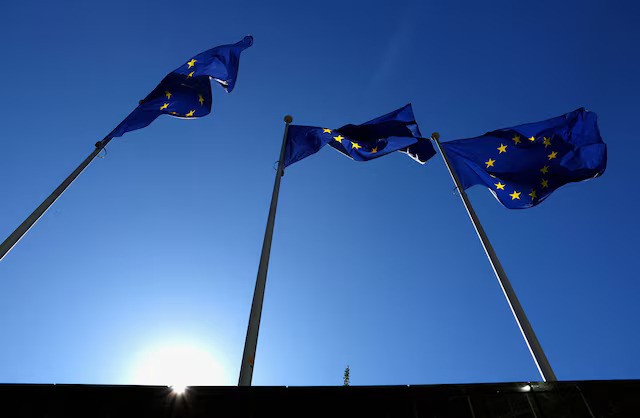 European Union flags flutter outside the EU Commission headquarters in Brussels, Belgium March 18, 2025. REUTERS/Yves Herman/File Photo