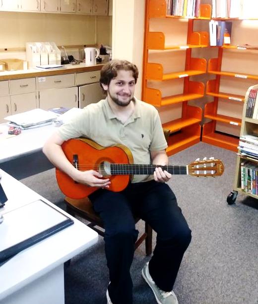 Photo of James and guitar