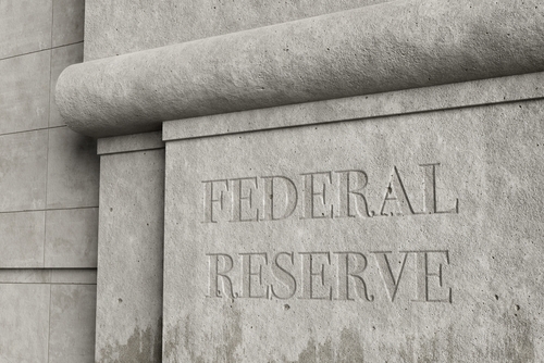 Retro style concrete wall engraved with the word FEDERAL RESERVE. 3D illustration of the concept of the issues and affairs related to federal reserve.