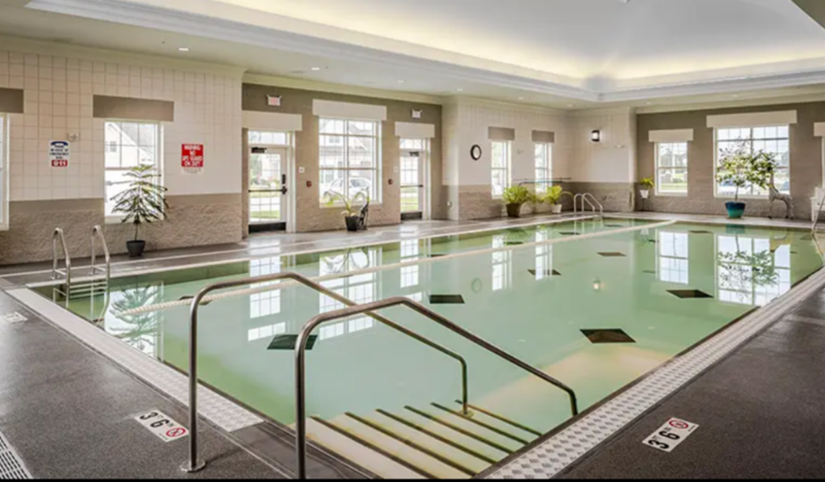Indoor shot of empty poolhouse and pool at Otterbein Senior Life Sunset Village, where open swim time is offered
