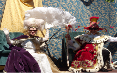 People in elaborate royal costumes at past Old West End Festival