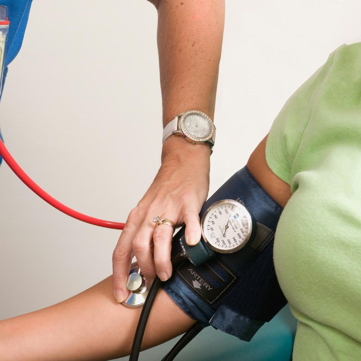 Photo of a person having their blood pressure taken