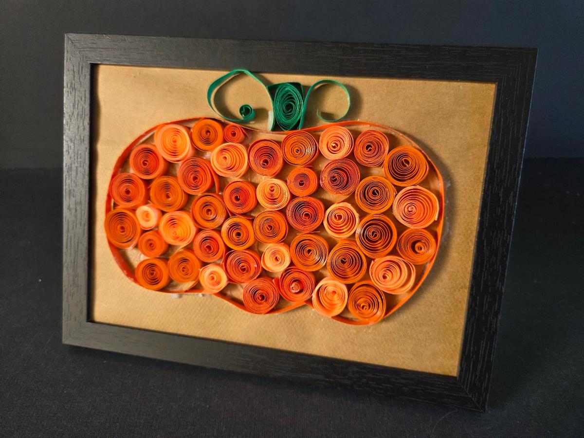Photo of a pumpkin made from coiled paper