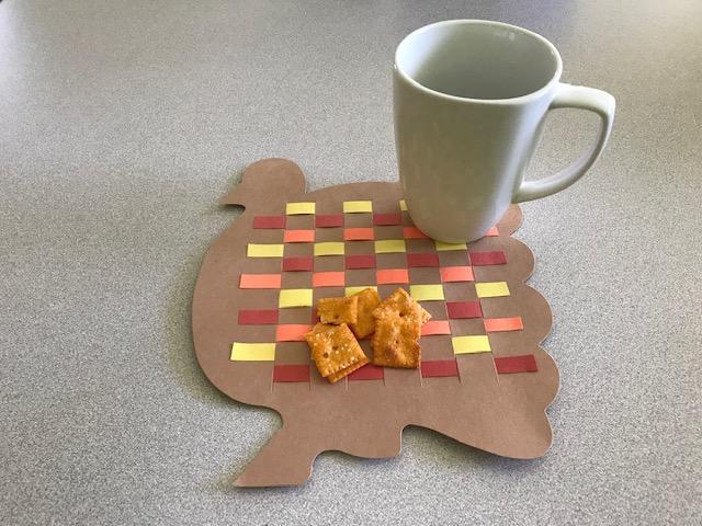 Photo of a turkey placemat woven from construction paper