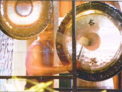 Photo of a person playing a gong