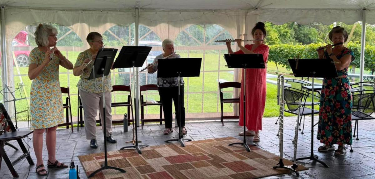 Photo of Flutistry performing under a white tent at Elmaro Vineyard, 2026.