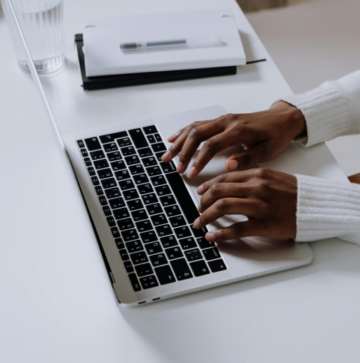 Decorative image of hands at computer