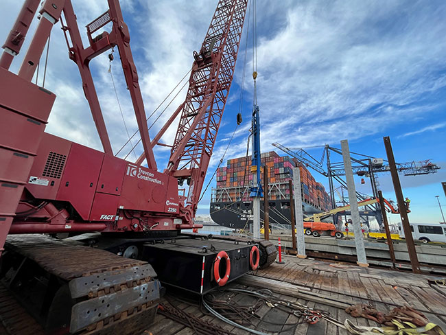 Trevcon's Junttan HHK-14s hydraulic impact hammer installing concrete pile.