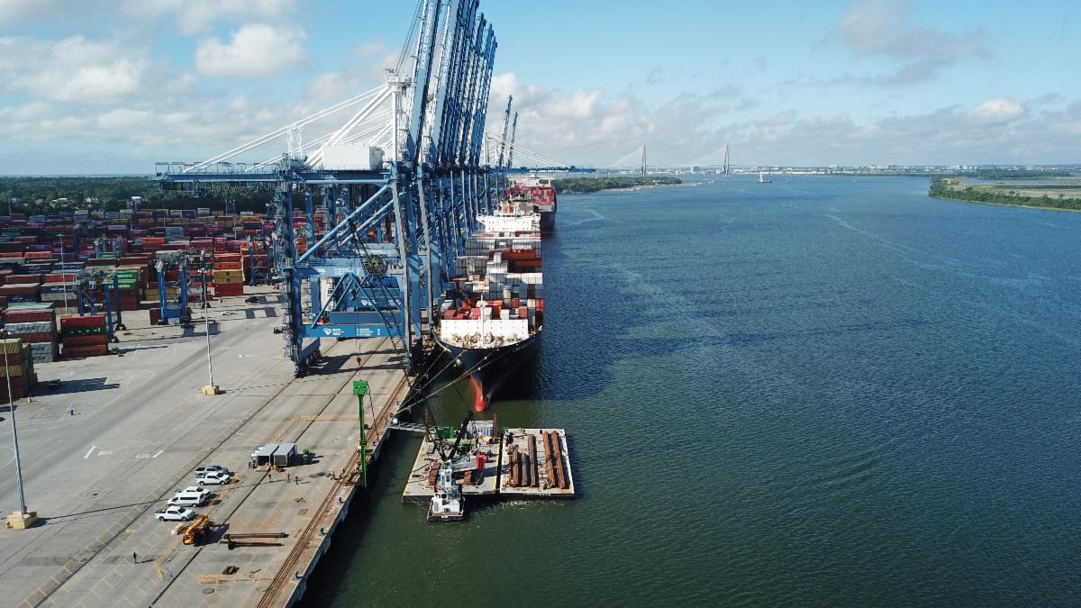 Construction barge in front of active terminal
