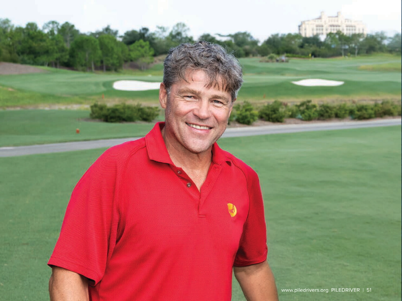 Man in red shirt on golf course