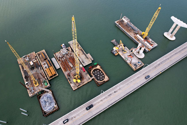 Pile driving operations at the site of the new fixed-span bridge being built over the Indian River near Fort Pierce, Fla.