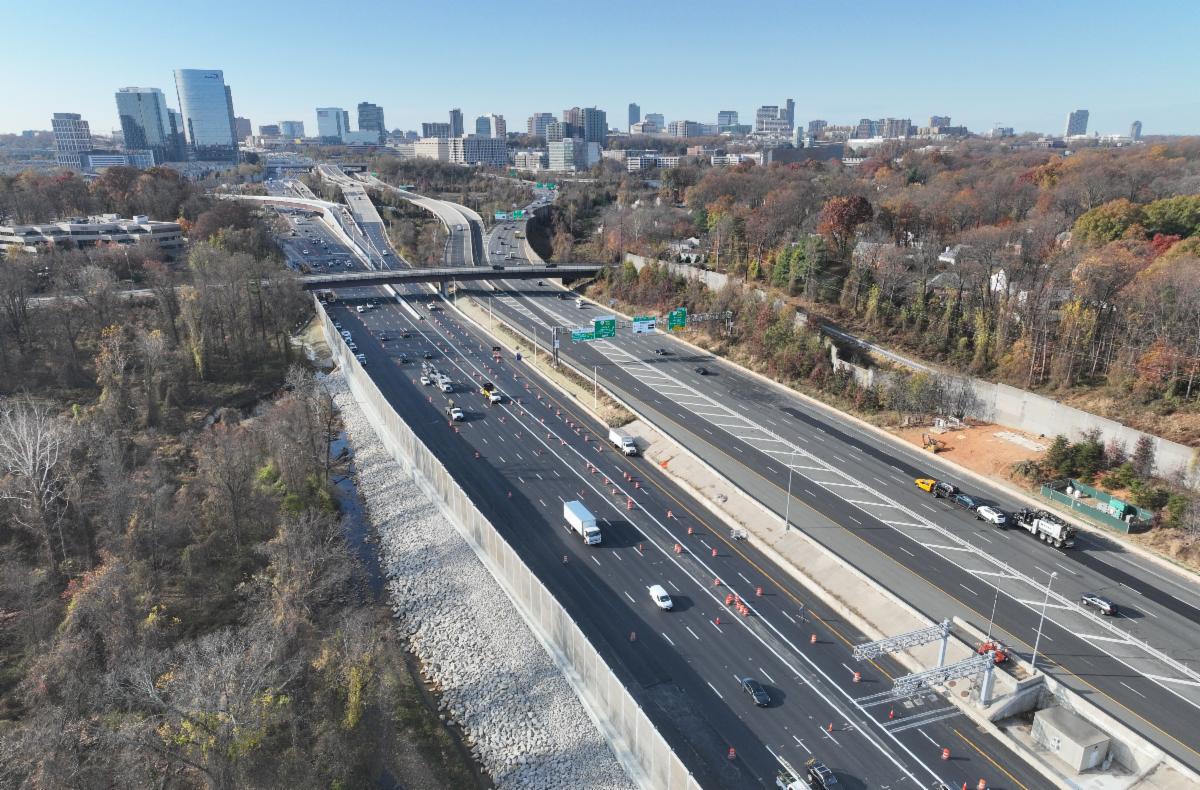 Aerial photo of I-495 (Capital Beltway) and 495 Express Lanes in McLean, VA. Buildings in Tysons, VA are visible in background of the photo.