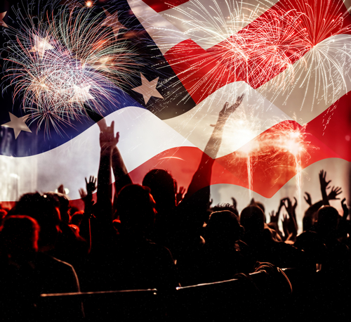 fireworks over United States flag - crowd celebrating 4th of July Independence Day