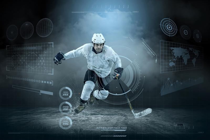 Ice hockey player on the ice around modern light