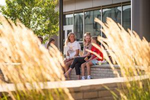 Student through the grass