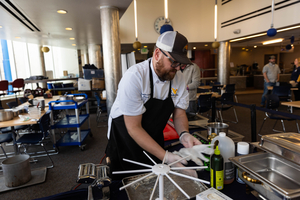 Chef preparing a meal at Talon's Table