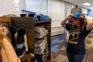 A student checks out merchandise at the Cheyenne Campus bookstore.