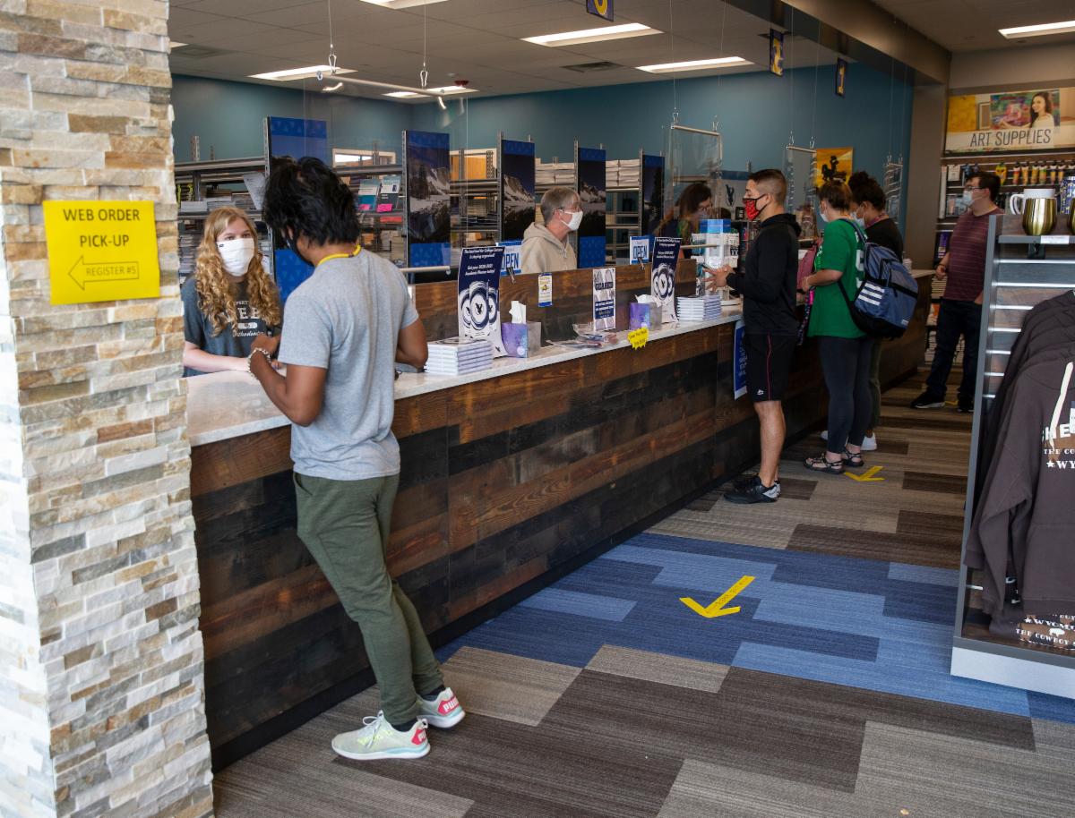 Student checking out at the LCCC Bookstore counter