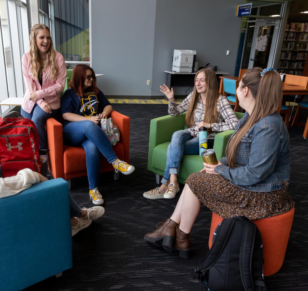 Students laughing together in the Library