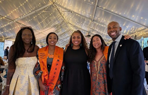 Right to left: Aurora City Councilman at Large Robert Andrews, Board Vice President Danielle Tomwing, Councilman Andrews' wife Genevieve Andrews, Board Director Dr. Anne Keke and Board Secretary Gayla Charrier, at the AfrikImpact event to honor Supt. Giles.