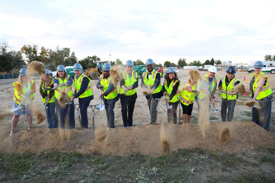 District, school, partners and community members along with Governor Jared Polis shovel the first load of dirt at the Health Sciences High School groundbreaking