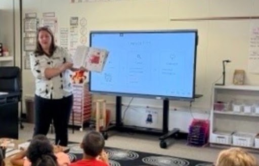 Board Director Kristin Mallory reads to first and third graders at Yale Elementary.