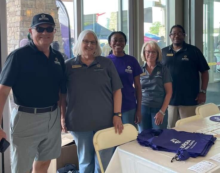 From left: Mark Seglem, Board Director Debbie Gerkin, Board President Dr. Anne Keke, Board Director Vicki Reinhard and Board Vice President Michael Carter attending the APS Back to School Event