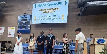 students earning awards at the Vista PEAK Half Cap ceremony