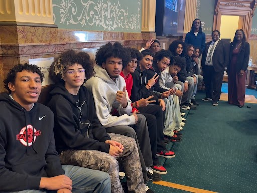 Board Secretary Gayla Charrier with the Rangeview Boys Basketball team at the Capitol