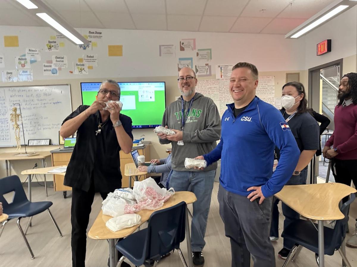 Other Mrachek staff members receive breakfast burritos from the Board