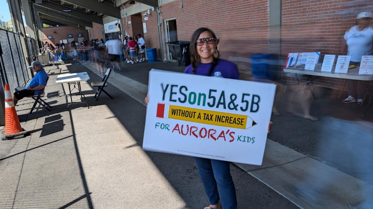 Board Secretary Danielle Tomwing attending handing out flyers at the Vista Peake vs East High School football game at the APS Stadium
