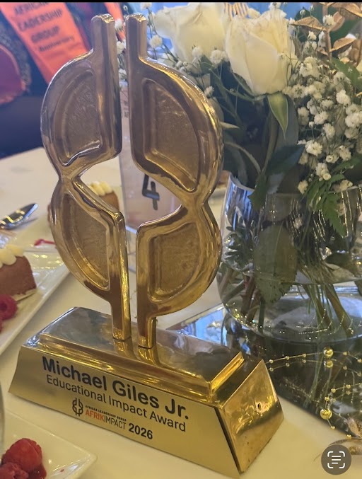 Educator Impact Award given to Superintendent Michael Giles, Jr. at the AfrikImpact event.