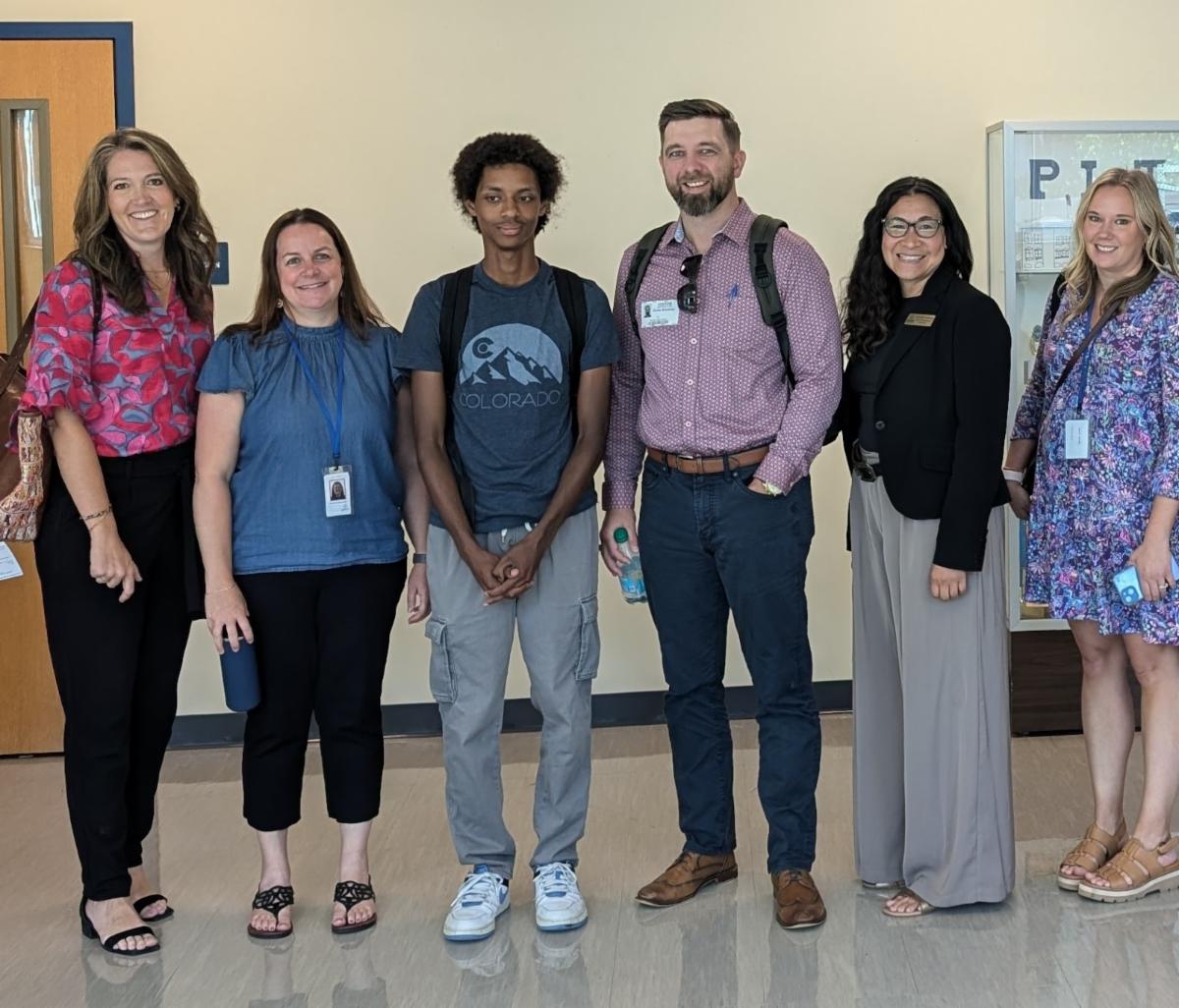 APS Foundation Executive Director Jill Ruiter together with APS Foundation Board Members, Hinkley High School student and teachers and Board Secretary Danielle Tomwing